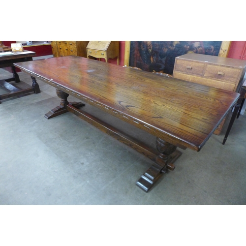 3 - A 17th Century style oak refectory table, 75cms h, 244cms l, 92cms w