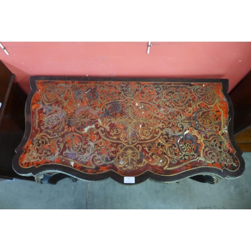 33 - A 19th Century French red Boulle, ebonised and gilt mounted fold over serpentine games table