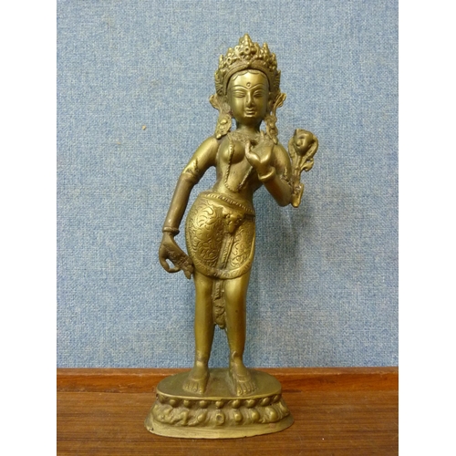 348 - An oriental bronze figure of a deity