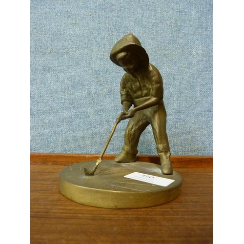 350 - A small bronze figure of a golfer