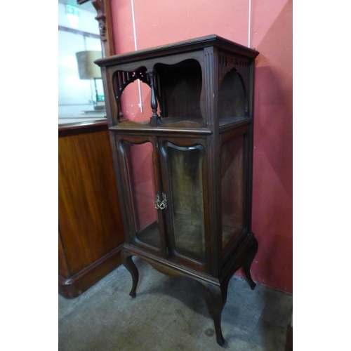 36 - An Arts and Crafts mahogany side cabinet