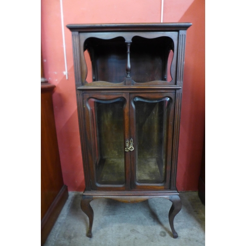 36 - An Arts and Crafts mahogany side cabinet