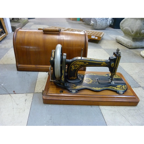 360 - A walnut cased Singer sewing machine