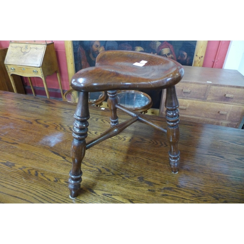 6 - A Victorian style elm saddle seat stool