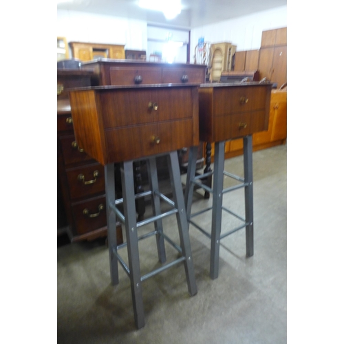 60 - A pair of afromosia two drawer chests on metal stands