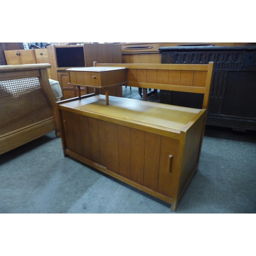 65 - A teak hall seat