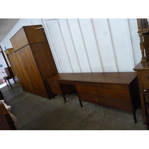 66 - A teak three piece bedroom suite, retailed by Heals of London