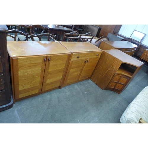 74 - A pair of Danish Domino Mobler teak cabinets, a/f, and a Nathan corner unit