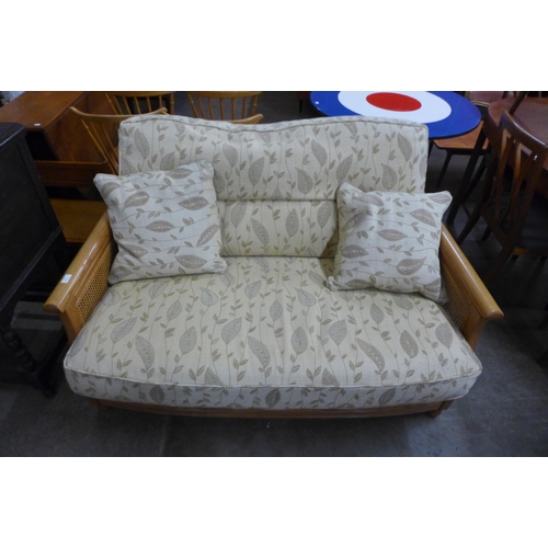 75 - An Ercol Blonde ash settee