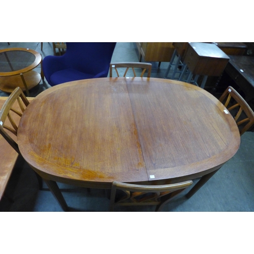 76 - A Nathan teak extending dining table and a set of six G-Plan Fresco teak chairs