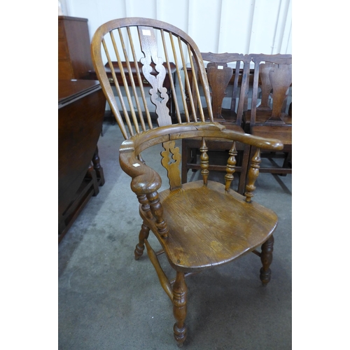 8 - A Victorian style elm highback Windsor armchair