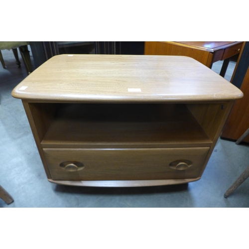 82 - An Ercol Blonde ash media unit