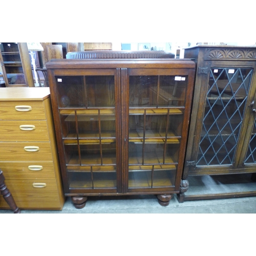 90 - An early 20th Century oak two door bookcase