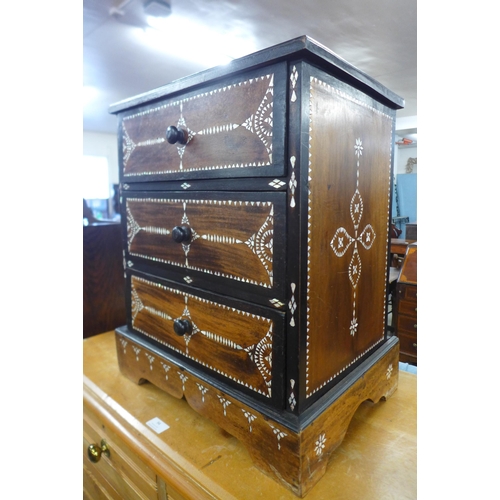 93 - An Anglo-Indian hardwood and mother of pearl inlaid table three drawer cabinet