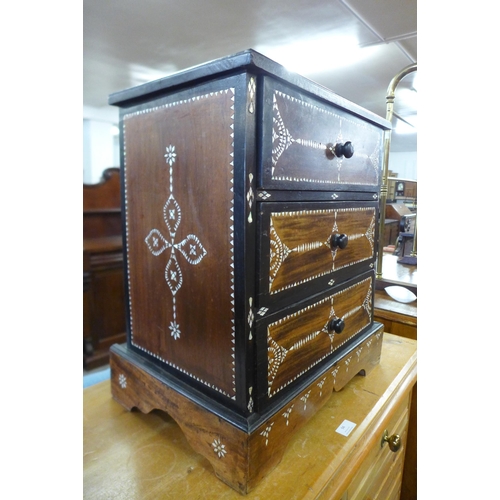 93 - An Anglo-Indian hardwood and mother of pearl inlaid table three drawer cabinet