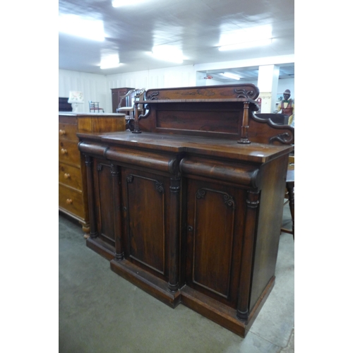 96 - A William IV rosewood breakfront three door sideboard