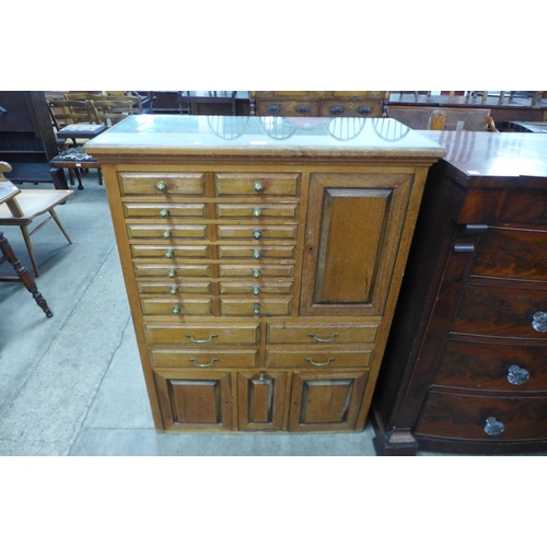 97 - An early 20th Century beech dentist's cabinet, 114cms h, 87cms w, 38cms d