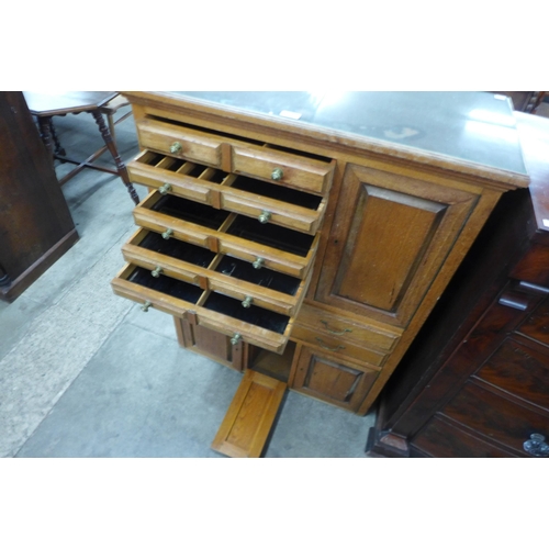 97 - An early 20th Century beech dentist's cabinet, 114cms h, 87cms w, 38cms d