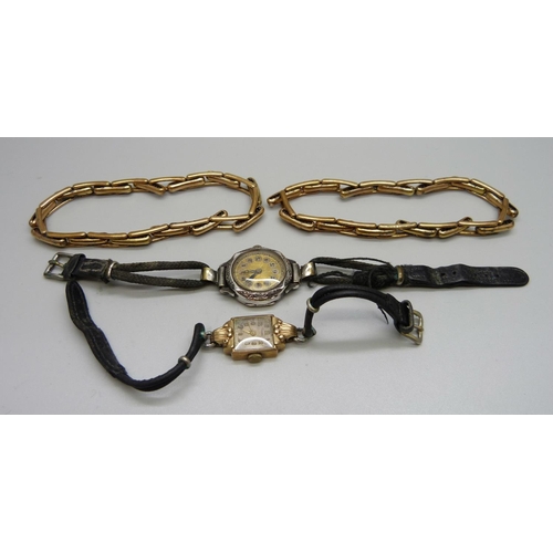 1041 - A 9ct gold wristwatch, a silver wristwatch and two plated sleeve garters