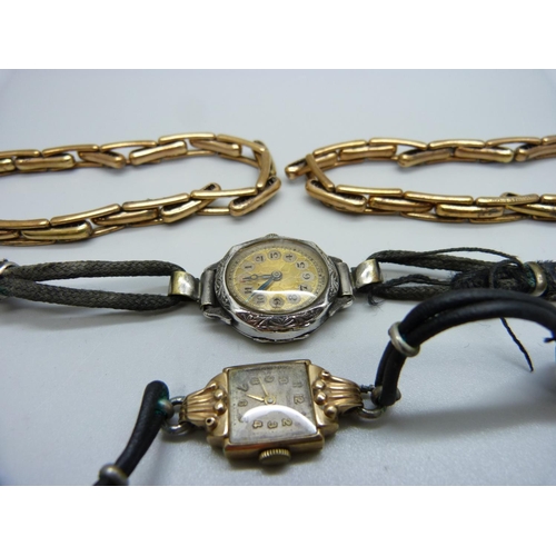 1041 - A 9ct gold wristwatch, a silver wristwatch and two plated sleeve garters