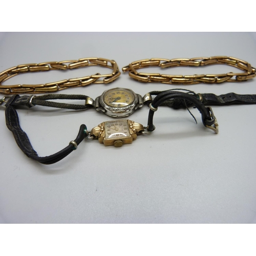 1041 - A 9ct gold wristwatch, a silver wristwatch and two plated sleeve garters