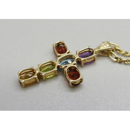 1042 - A 9ct gold multi gem set cross pendant on a 9ct gold chain, 2.9g