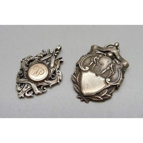 1049 - Two early 20th Century silver cricket fobs