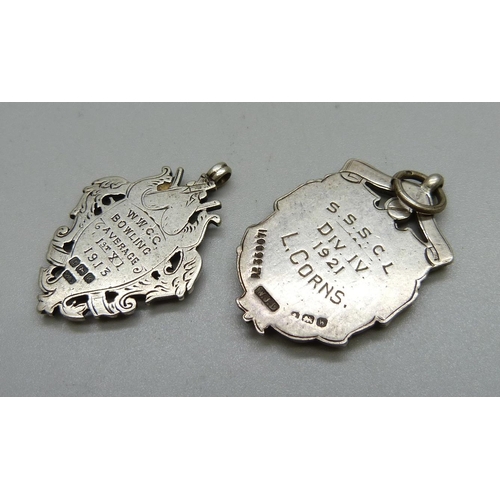 1049 - Two early 20th Century silver cricket fobs