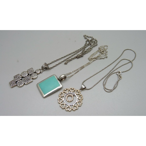 1055 - Three silver pendants and chains