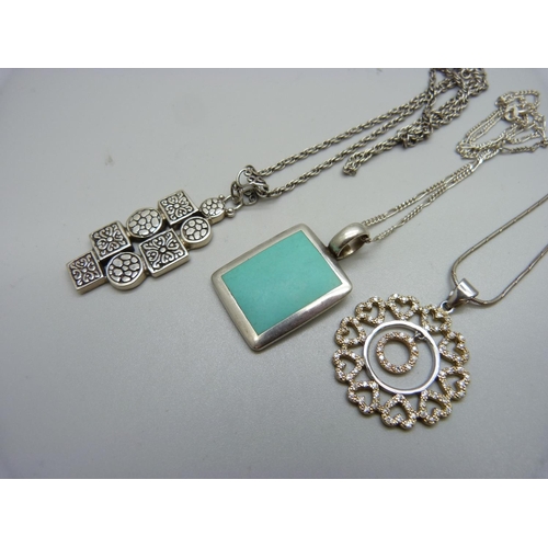 1055 - Three silver pendants and chains