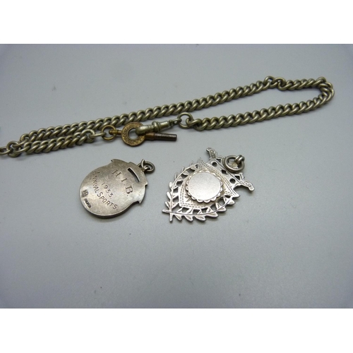 1060 - A metal Albert chain and two silver fobs