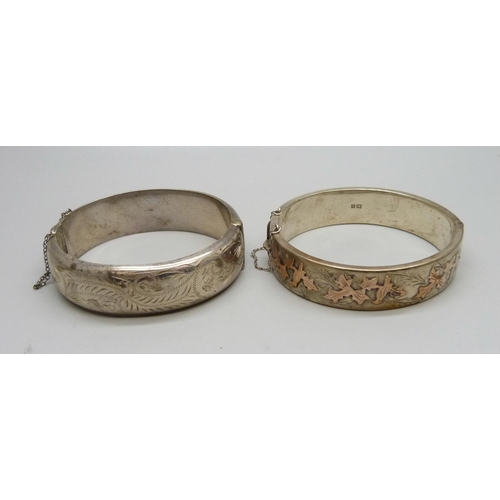 1062 - Two silver bangles, one with applied gold decoration, 54g, each dented