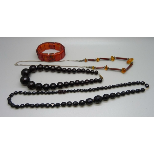 1071 - A faceted sherry amber bead necklace, two other necklaces and a bracelet