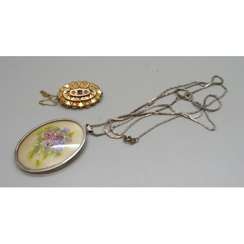 1087 - A Victorian 9ct gold, garnet and seed pearl set brooch, 4.1g, and a silver pendant and chain