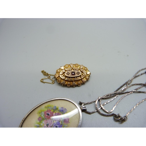 1087 - A Victorian 9ct gold, garnet and seed pearl set brooch, 4.1g, and a silver pendant and chain