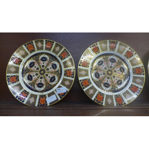 603 - Four Royal Crown Derby 1128 pattern dinner plates, seconds