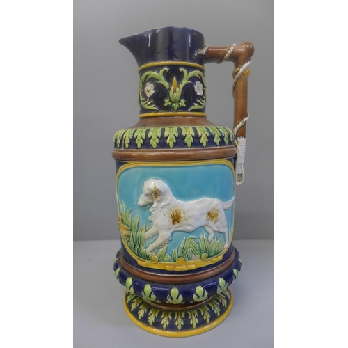 604 - A 19th Century George Jones majolica hunting themed ewer, hairlines to the top rim