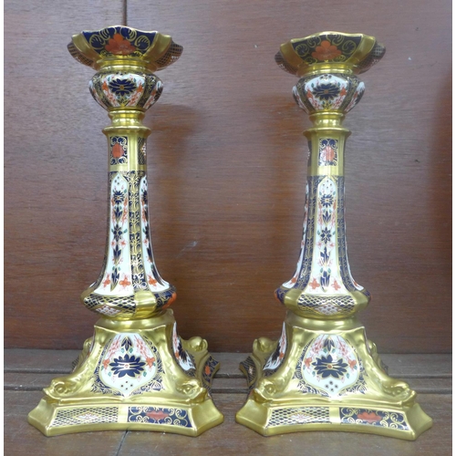 609 - A pair of Royal Crown Derby 1128 pattern candlesticks, seconds