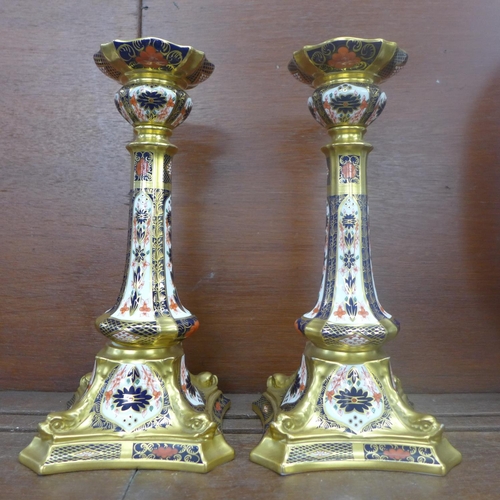 609 - A pair of Royal Crown Derby 1128 pattern candlesticks, seconds