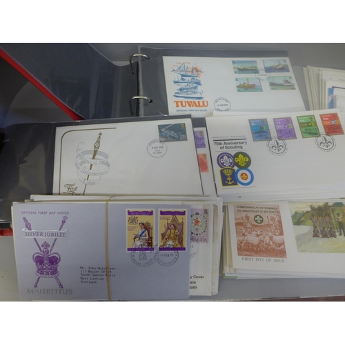 668 - Stamps; a tray of assorted first day covers in albums and loose