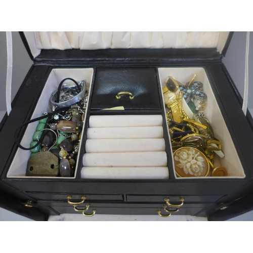 670 - Costume jewellery in black jewellery box