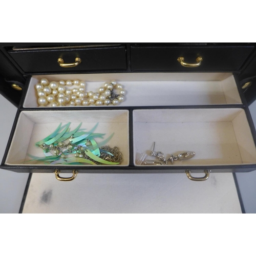 670 - Costume jewellery in black jewellery box