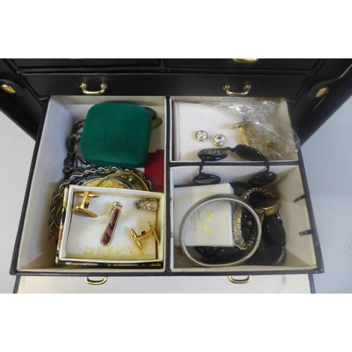 670 - Costume jewellery in black jewellery box