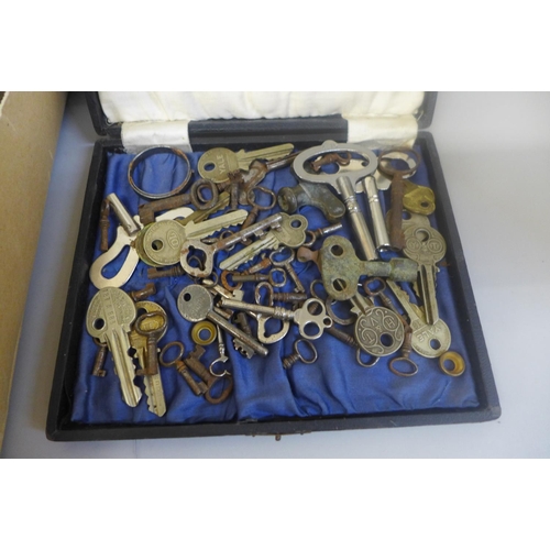 685 - A collection of cabinet keys, door furniture, etc.