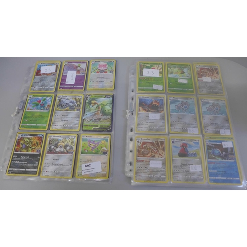 692 - 198 Assorted holographic Pokemon cards