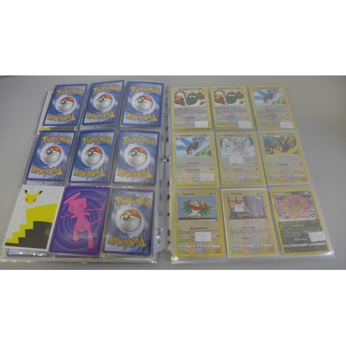 692 - 198 Assorted holographic Pokemon cards