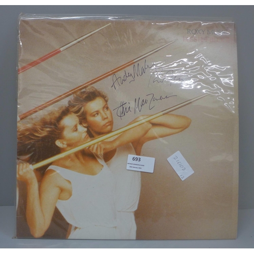 693 - A Roxy Music autographed LP record, Flesh and Blood signed by Brian Ferry, Andy Mackay and Phil Manz... 