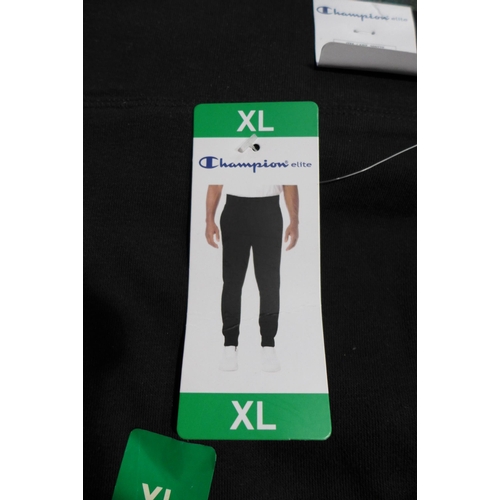 3225 - Bag of men's black XL Champion joggers * this lot is subject to VAT