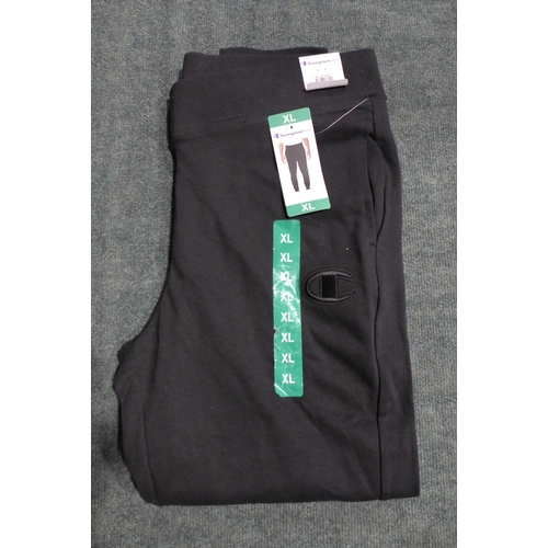 3226 - Bag of boy's black Champion joggers - mixed size * this lot is subject to VAT