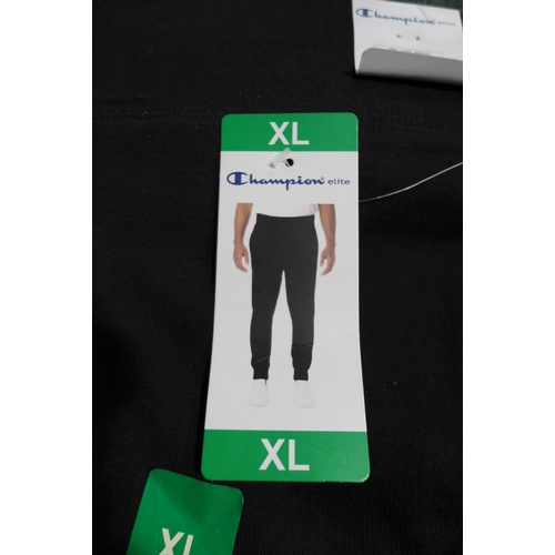 3226 - Bag of boy's black Champion joggers - mixed size * this lot is subject to VAT